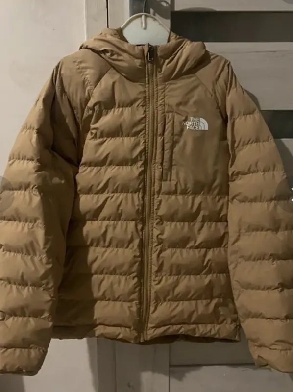Before: tan hooded puffer jacket photographed on a hanger at home